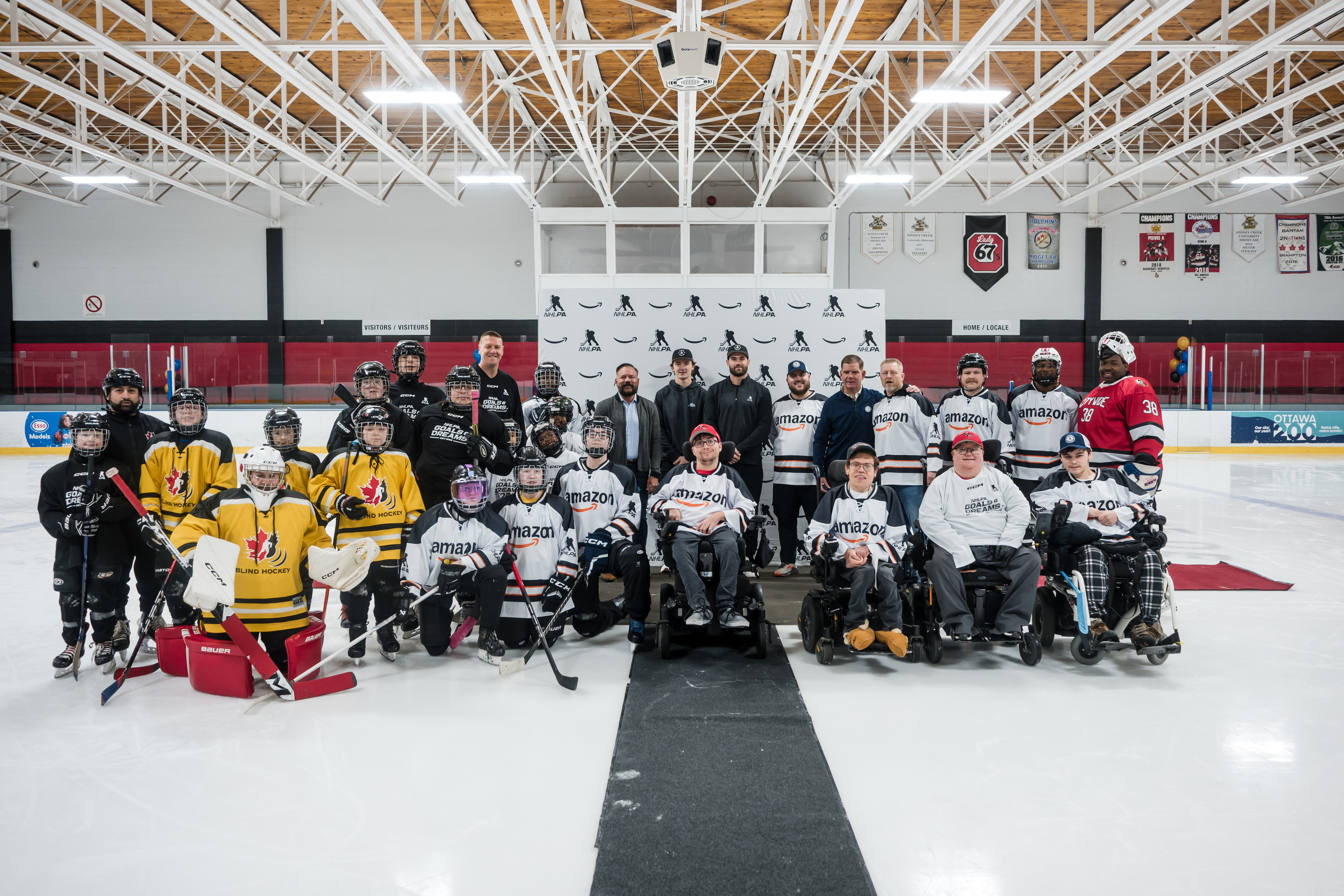 Amazon and NHLPA charity event with Next Shift athletes on ice in Ottawa